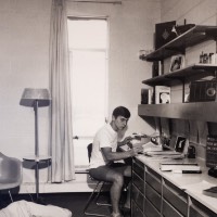 Old picture of 2 boys in their dorm studying